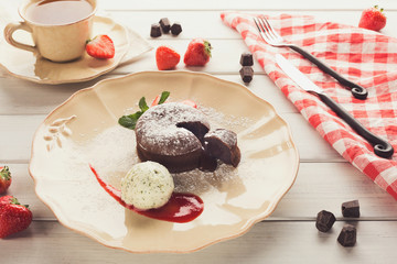 Chocolate fondant with vanilla ice cream and strawberry