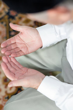 Praying hands of an old man. Shallow dof