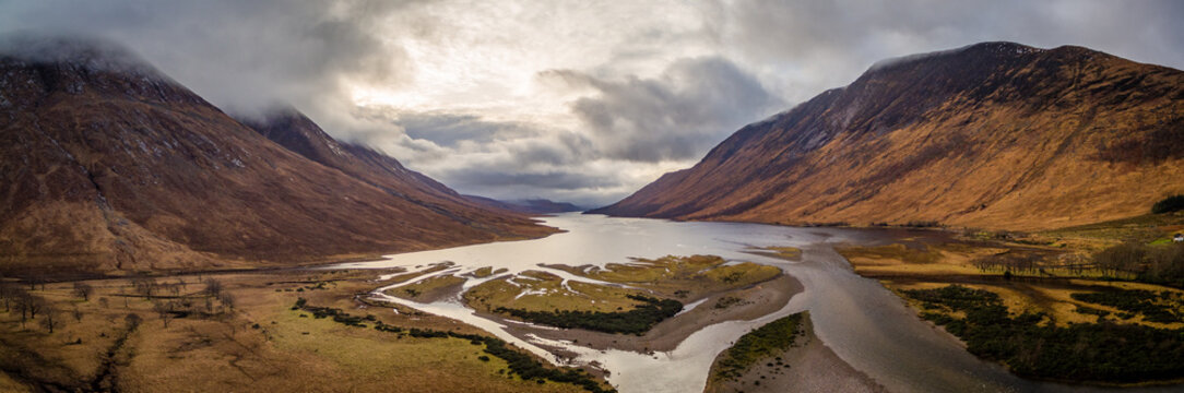 landscape view of scotland and glen etive in winter from an aerial viewpoint in panoramic landscape format