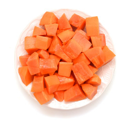 Papaya fruit in dish on white background.