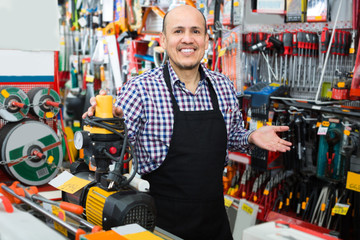 salesman offering modern electric pump