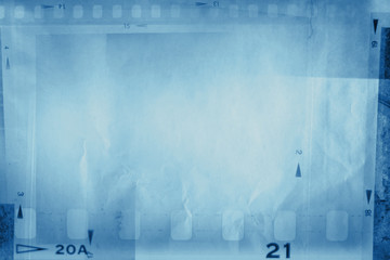 Blue filmstrip film frames background. Copy space
