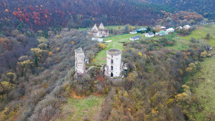 Fototapeta na wymiar Aerial view on destroyed towers of the castle on the hill