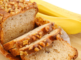 Sliced banana nut bread on a cutting board