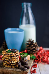 Nut biscuits with icing and a cup of milk