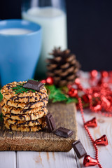 Nut biscuits with icing and a cup of milk