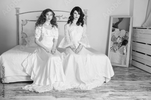 Two Beautiful Girls With Red Hair In A Beautiful White