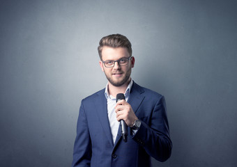 Businessman holding microphone