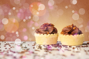 Delicious tasty homemade cakes with bokeh light background