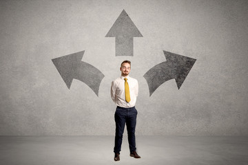 Businessman standing with three arrows