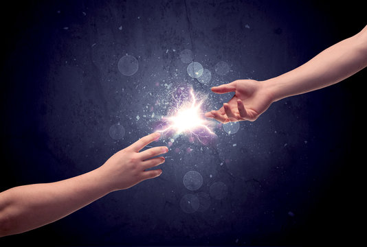 Hands reaching to light a spark