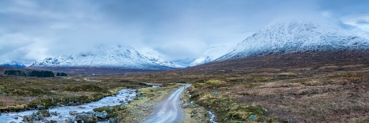 landscape view of scotland and buchaille etive mor in glencoe in the remote highlands of scotland with snow capped peaks in winter