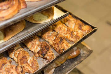 baking pastries and bread in an oven at a bakery