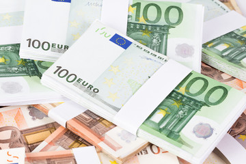 Closeup pile of fifty and one hundred euro banknotes