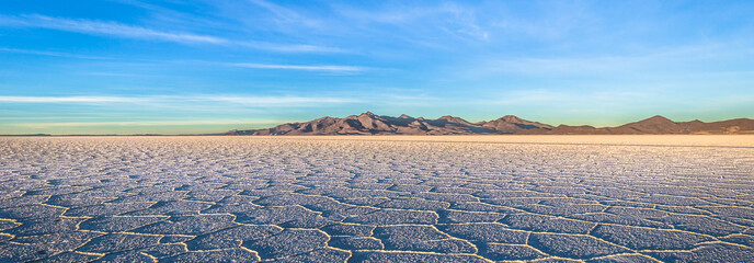 Landscape of the Uyuni Salt Flats at sunrise, Bolivia - obrazy, fototapety, plakaty
