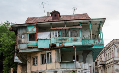 Wooden house with carved turquoise balcony, Georgia