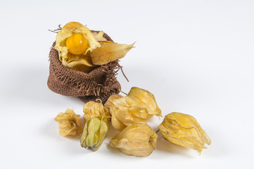 physalis fruit Physalis peruviana and some peeled ones on a white background