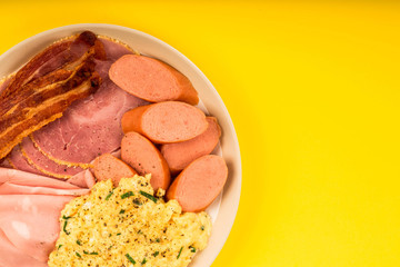 Swedish or Norwegian Style Scrambled Eggs Sausage Bacon and Ham Breakfast