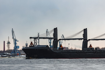 Naklejka premium Black cargo ship