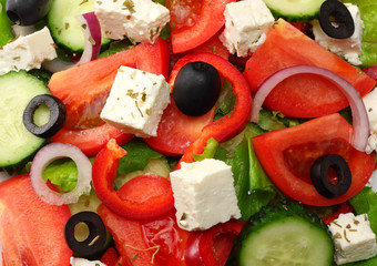 Square plate of greek salad isolated on white. fresh vegetable salad top view