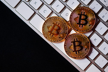 Bitcoins on computer keyboard