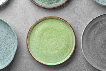 Ceramic plates on grey background