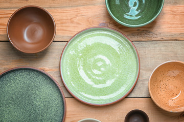 Ceramic tableware on wooden background