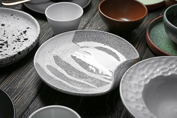 Ceramic tableware on wooden background