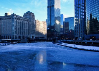 Frigid, blue morning in Chicago during January freeze with view of a frozen river near Merchandise...