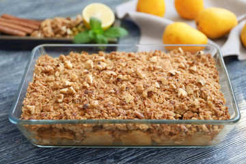 Glass baking dish with apple crisp on table