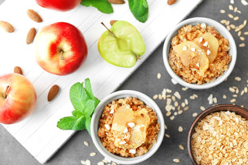 Ramekins with apple crisp on table, top view