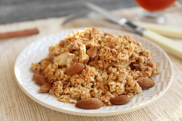 Plate with apple crisp on table, closeup