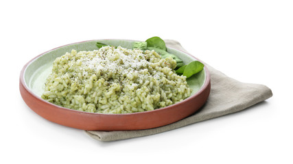Plate with delicious spinach risotto on white background