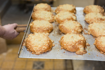 baking pastries and bread in an oven at a bakery