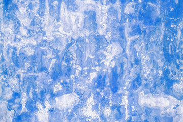 Grunge weathered blue paint concrete wall background.