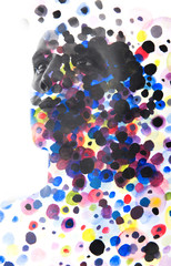 Paintography. Close up of man with strong features and flawless skin dissolving behind hand painted colorful watercolor dots