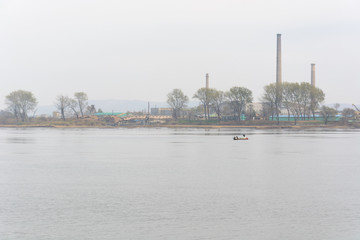 Fototapeta na wymiar Yalu River Bridge and Landscape of North Korea. Taken from Dandong, Liaoning, China.