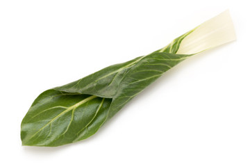 Spinach leaves close up isolated on white.