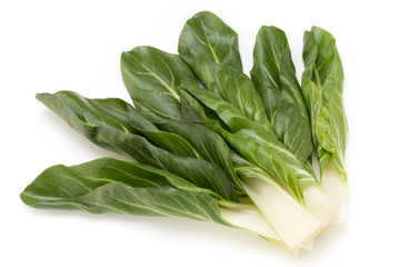 Spinach leaves close up isolated on white.
