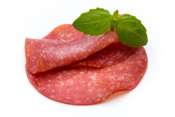 Salami slices isolated on white background.