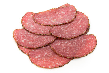 Salami slices isolated on the white background.