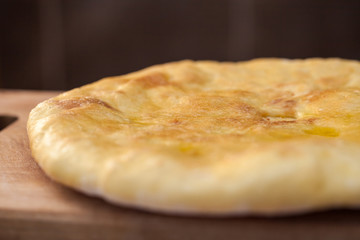 Traditional Georgian pie - khachapuri, is a cake baked in the oven with cheese