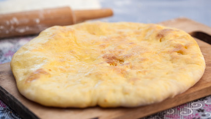Traditional Georgian pie - khachapuri, is a cake baked in the oven with cheese