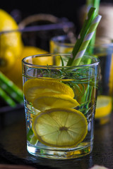 Ingredients for making flu fighting natural hot drink. Oranges, mint, lemons, ginger, honey, apple and spices over plywood background, top view, copy space. Clean eating, detox, dieting concept