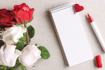 Roses and a blank spiral notebook with heart - Open spiral notebook with stripes and a wooden clip...