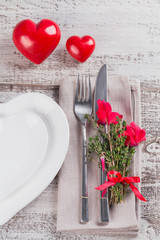 Rustic table setting with thyme and cyclamen flowers