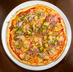 Pizza on a table on a round plate