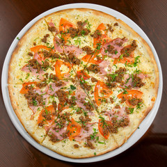 Pizza on a table on a round plate