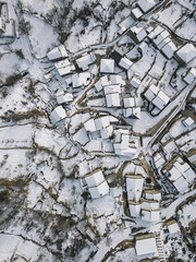 Aerial view of a small village after a heavy snowfall in Guadalajara,  Spain