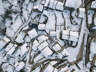 Aerial view of a small village after a heavy snowfall in Guadalajara,  Spain